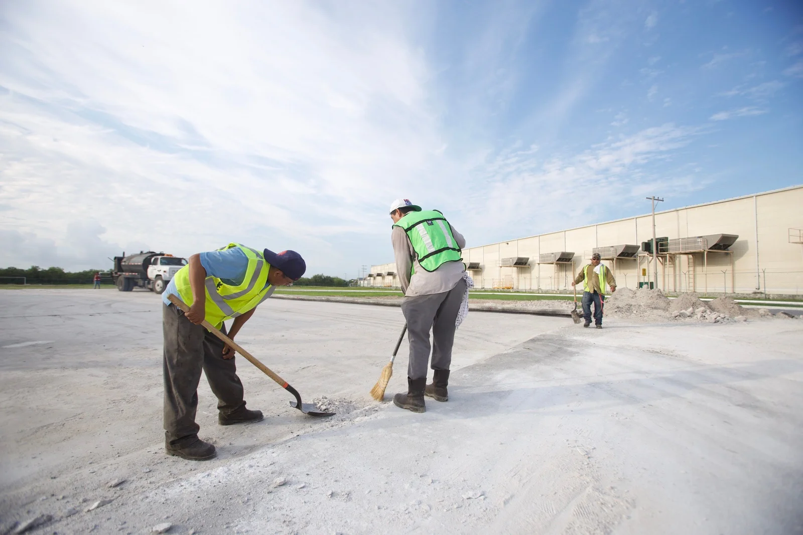 Construction cleaners completing initial and final builder's cleaning at a commercial site