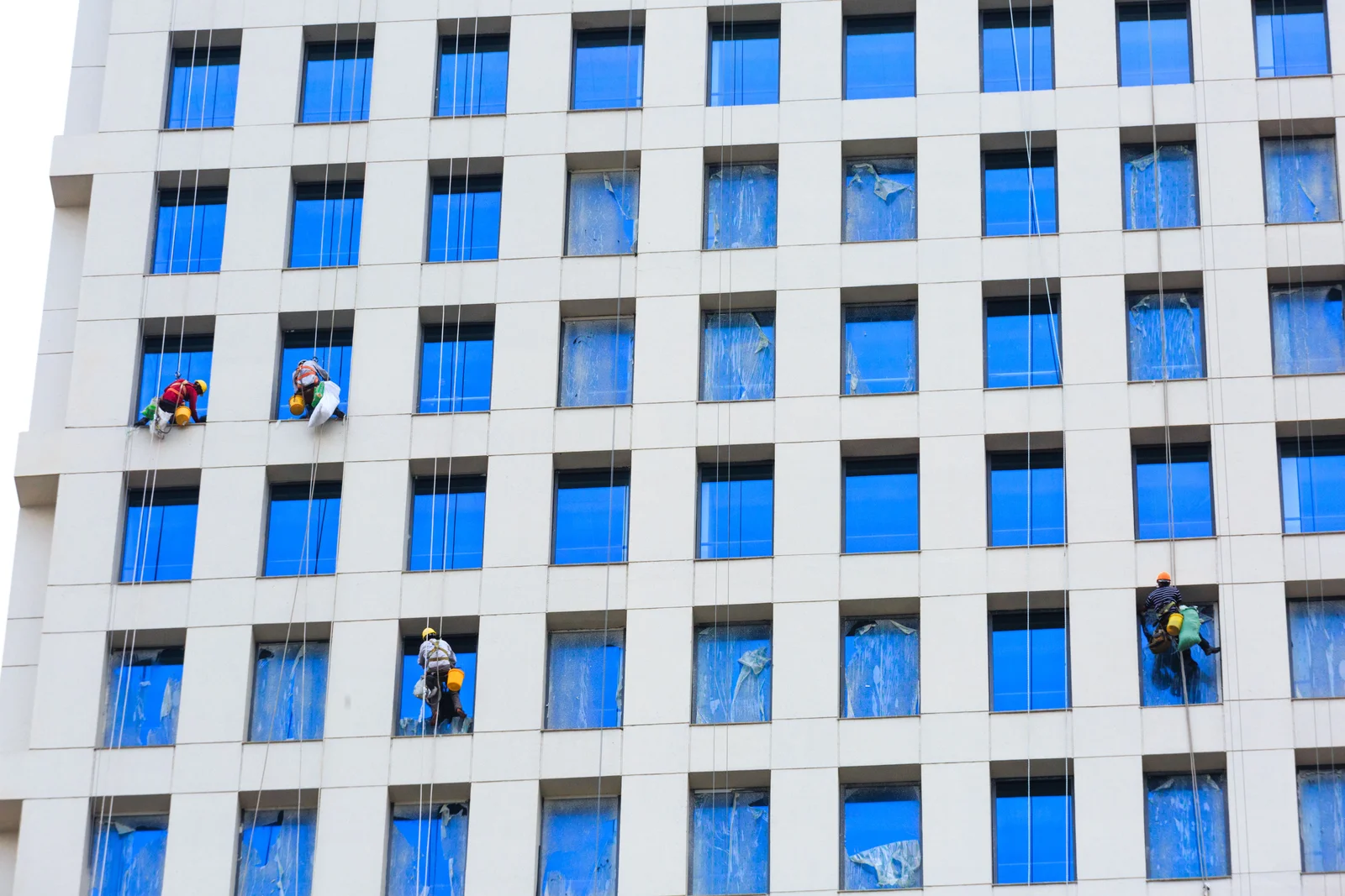 Professional facade cleaning of commercial building windows and external surfaces
