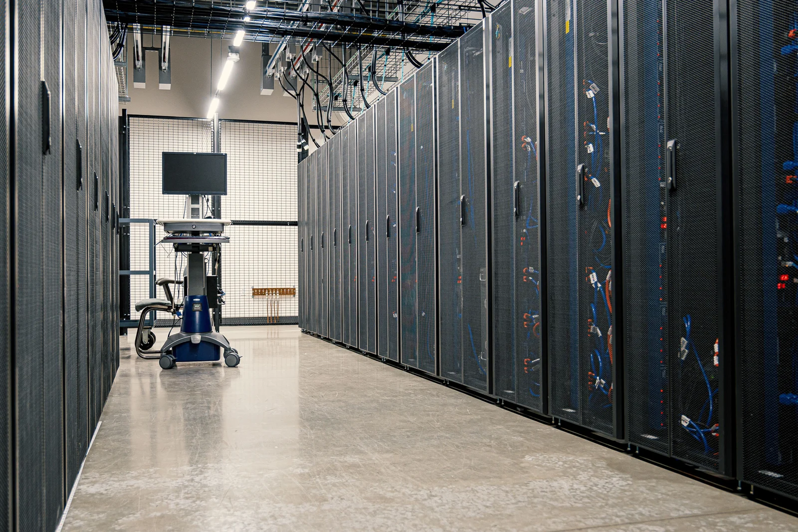 Server room with data centre racks and raised access flooring requiring specialist de-dusting