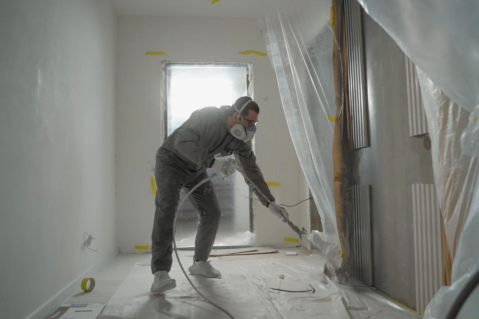Temporary protective coverings installed over surfaces during construction